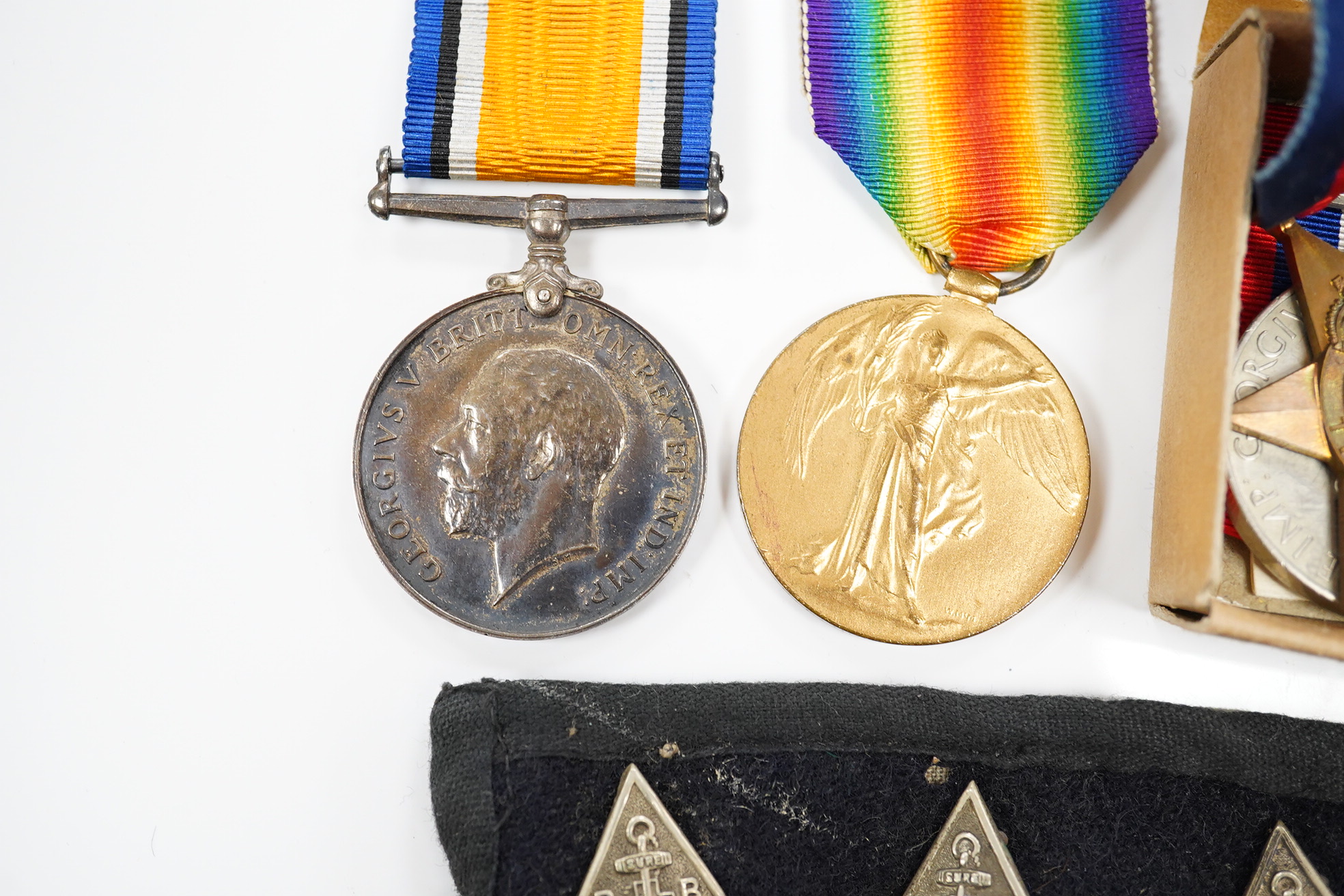 Twelve medals including; a First World War pair to Pte. C.F. Humphreys R. Sussex Reg., and three WWII medal groups, two in original card issue boxes and including the Burma star, the Africa star, etc. plus a few other it